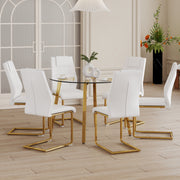 Table and chair set.A Modern Minimalist Style Round Clear Tempered Glass Table with Metal Legs.Paried with white chairs with Modern PU Leather High Back Upholstered and C-Tube Golden Legs.