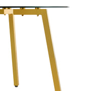 Table and chair set.Modern circular transparent tempered glass table, tempered glass tabletop, golden metal table legs.A Set of  6 Transparent Plastic Chairs with gold legs.
